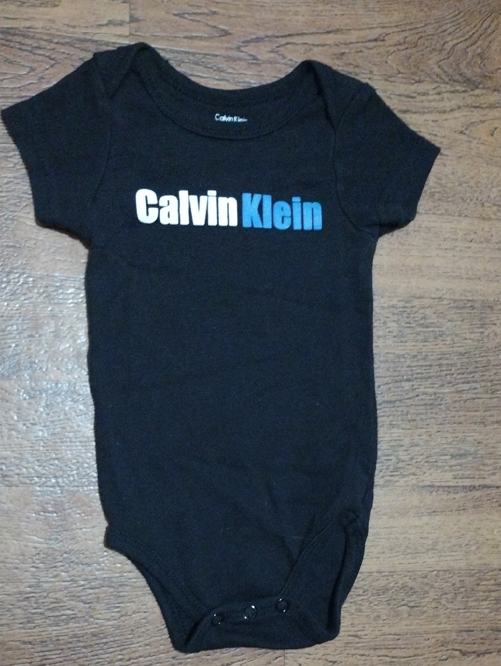 Calvin Klein Black Baby One-Piece with White and Blue Logo